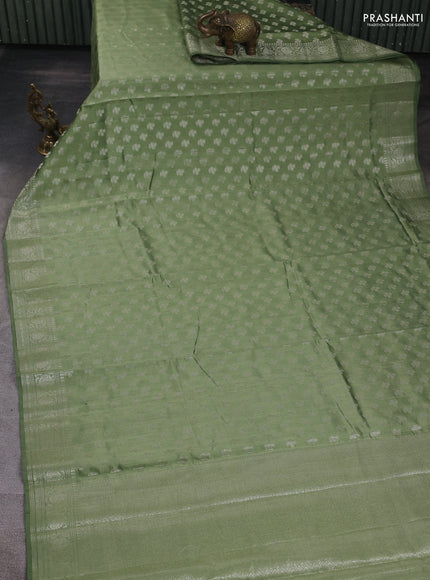 Chiniya silk saree pastel green with allover zari woven buttas and zari woven border