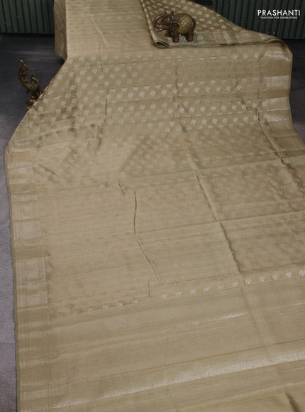 Chiniya silk saree elaichi green with allover zari woven buttas and zari woven border