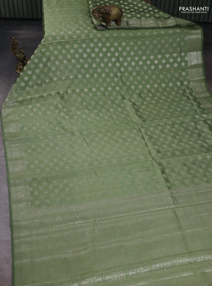 Chiniya silk saree pastel green with allover zari woven buttas and zari woven border