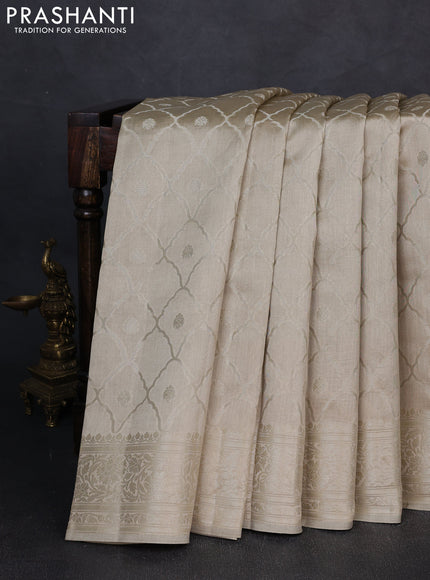 Chiniya silk saree beige with allover zari weaves and zari woven border