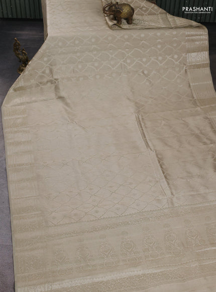 Chiniya silk saree beige with allover zari weaves and zari woven border