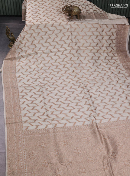 Banarasi semi raw silk saree cream with allover thread & zari weaves and woven border