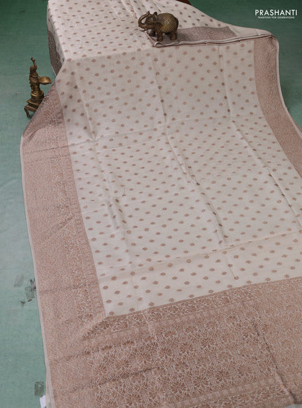 Banarasi semi raw silk saree cream with thread & zari woven buttas and woven border