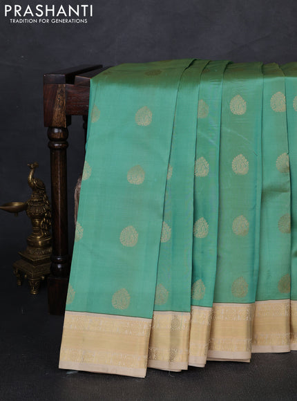 Pure kanchipuram silk saree pastel green and cream with annam zari woven buttas and zari woven korvai border