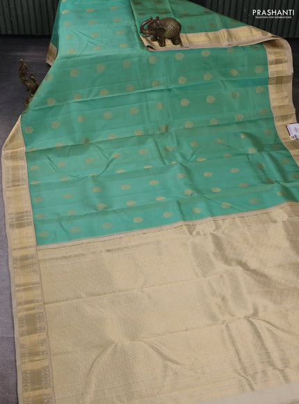 Pure kanchipuram silk saree pastel green and cream with annam zari woven buttas and zari woven korvai border