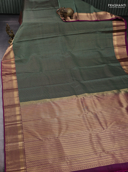 Pure kanchipuram silk saree green shade and purple with allover zari weaves and zari woven border
