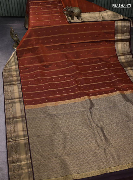 Pure kanchipuram silk saree orange and coffee brown with allover zari weaves and zari woven border