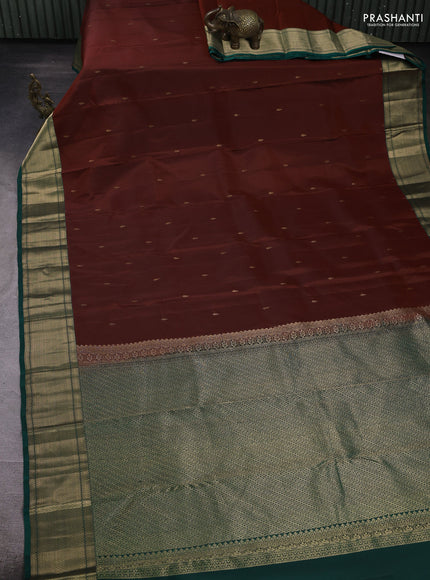Pure kanchipuram silk saree rust shade and green with zari woven buttas and zari woven border