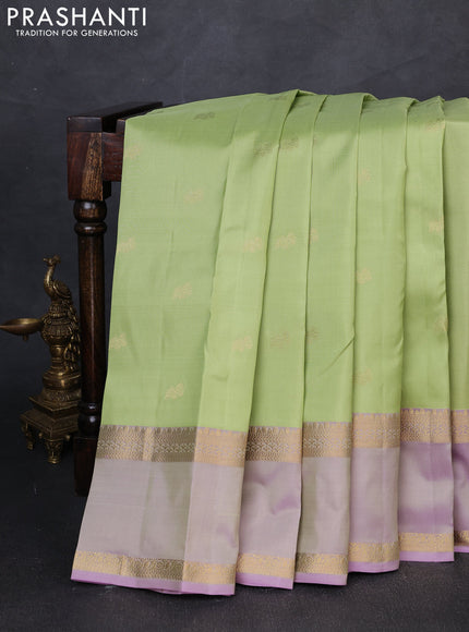 Pure kanchipuram silk saree pista green and pastel lavender with zari woven buttas and rettapet zari woven border