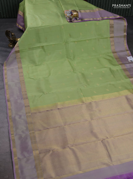 Pure kanchipuram silk saree pista green and pastel lavender with zari woven buttas and rettapet zari woven border