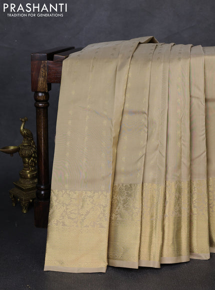 Pure kanchipuram silk saree beige with zari woven buttas and rich zari woven border