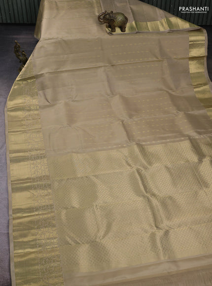 Pure kanchipuram silk saree beige with zari woven buttas and rich zari woven border