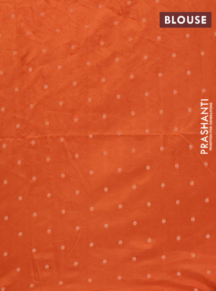 Semi raw silk saree orange with allover self emboss & zari buttas and zari woven border