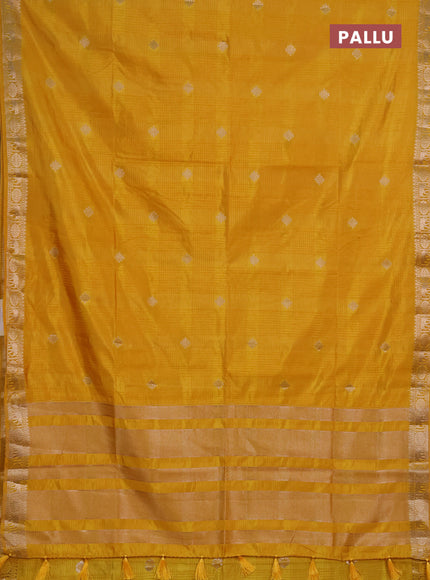 Semi raw silk saree mustard yellow with allover self emboss & zari buttas and zari woven border
