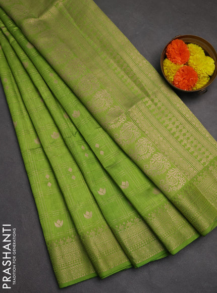 Semi raw silk saree light green with allover zari checks & buttas and zari woven border