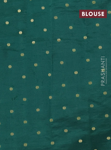 Semi raw silk saree bottle green with allover zari woven buttas and zari woven border