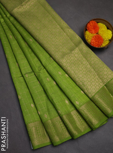Semi raw silk saree light green with allover zari checks & buttas and zari woven border