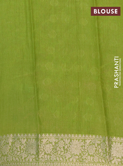 Semi raw silk saree light green with zari woven buttas and zari woven border