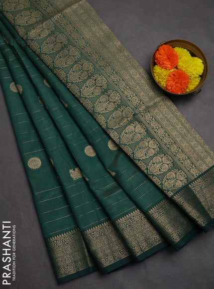 Semi raw silk saree bottle green with allover zari weaves & buttas and zari woven border