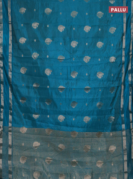 Semi raw silk saree teal blue with allover zari weaves and rettapet zari woven border