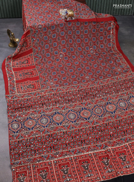 Modal silk saree rust shade with allover ajrakh prints & sequin mirror work and sequin embroidery pallu