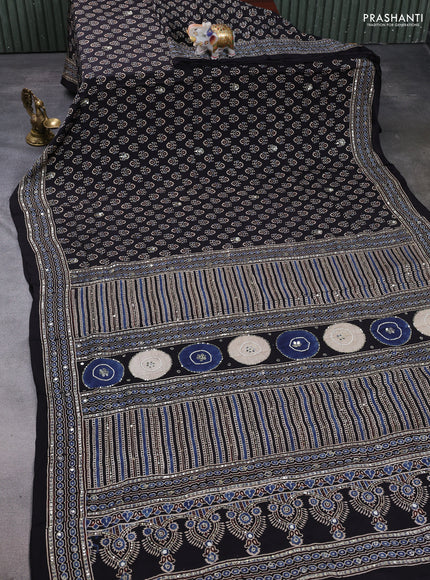 Modal silk saree black with allover ajrakh prints & sequin mirror work and sequin embroidery pallu