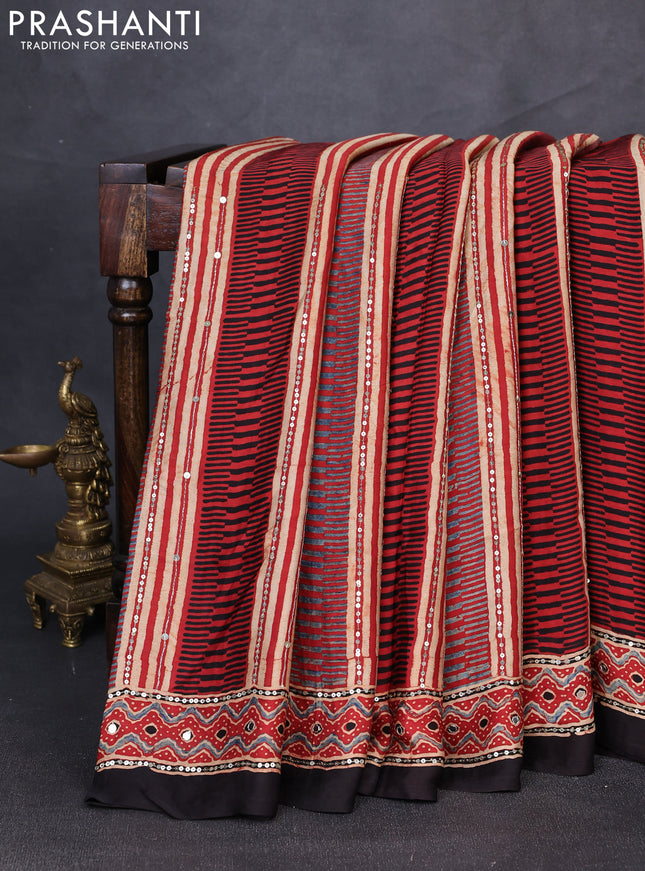 Modal silk saree rust shade and black with allover ajrakh prints & sequin mirror work and sequin embroidery pallu
