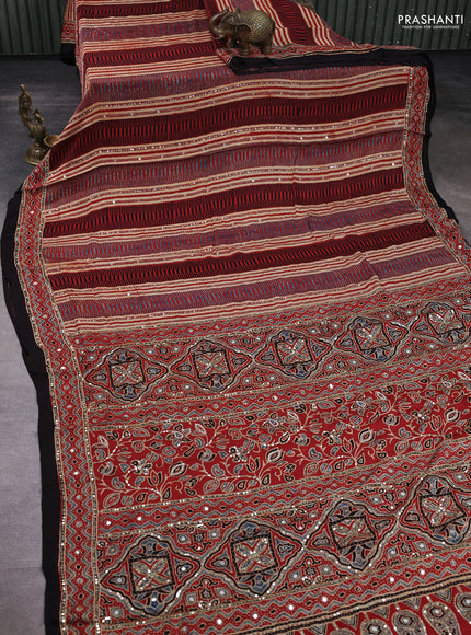 Modal silk saree rust shade and black with allover ajrakh prints & sequin mirror work and sequin embroidery pallu