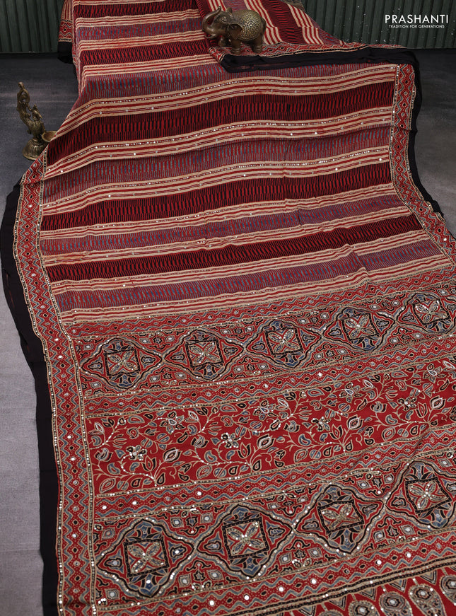 Modal silk saree rust shade and black with allover ajrakh prints & sequin mirror work and sequin embroidery pallu