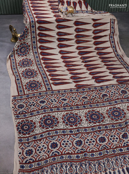 Modal silk saree beige with allover ajrakh prints and printed border