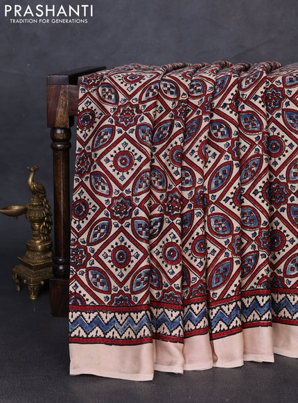 Modal silk saree beige with allover ajrakh prints and printed border