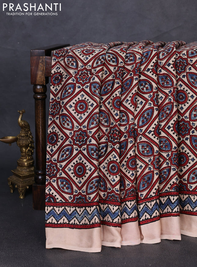 Modal silk saree beige with allover ajrakh prints and printed border