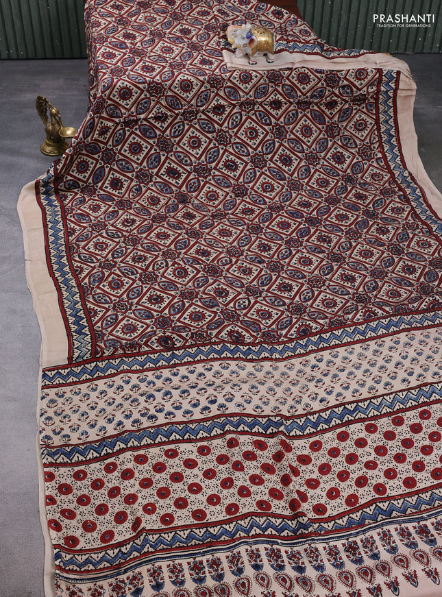 Modal silk saree beige with allover ajrakh prints and printed border