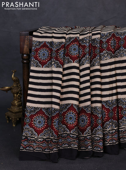 Modal silk saree black beige and black with allover ajrakh prints and printed border