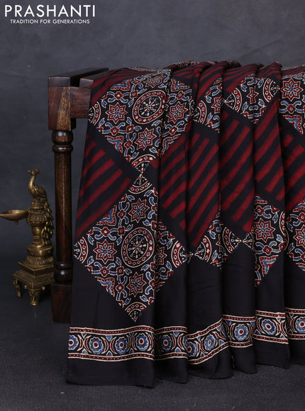 Modal silk saree black with allover ajrakh prints and printed border