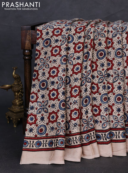 Modal silk saree beige with allover ajrakh prints and printed border