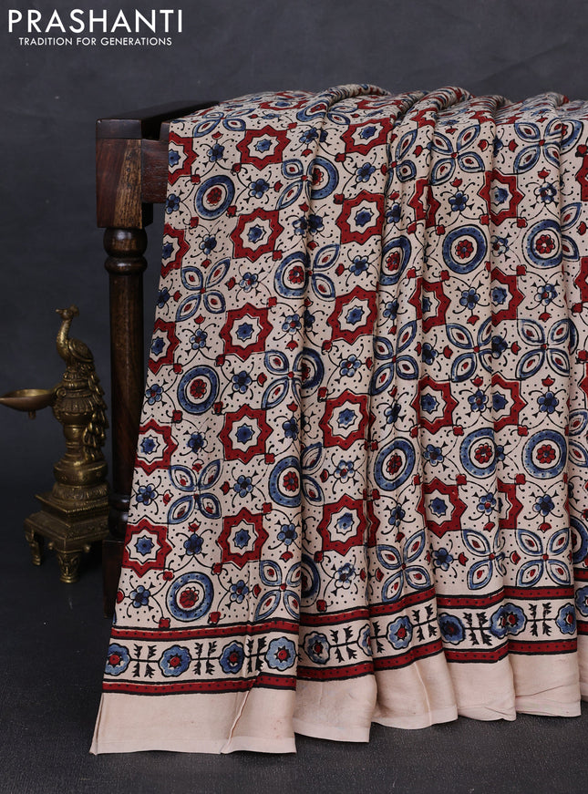 Modal silk saree beige with allover ajrakh prints and printed border