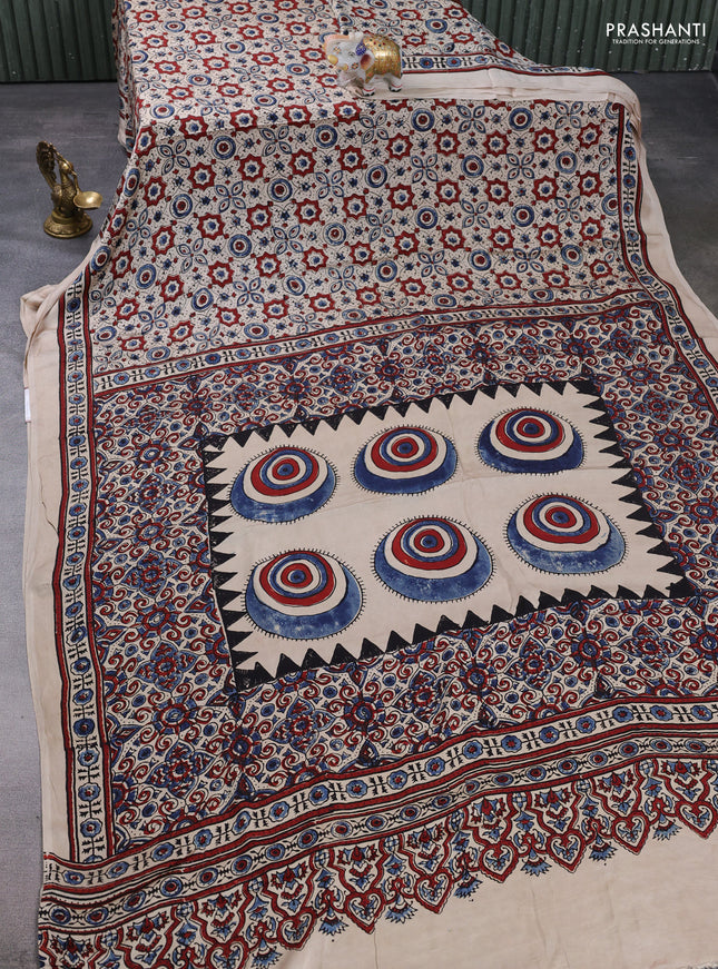 Modal silk saree beige with allover ajrakh prints and printed border