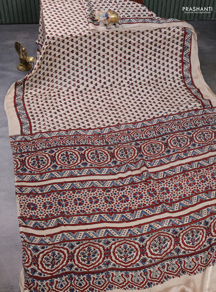 Modal silk saree beige with allover ajrakh prints and printed border