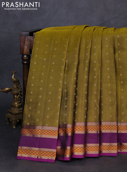 Pure kanchipuram silk saree mehendi green and purple with allover zari woven buttas and rettapet zari woven border