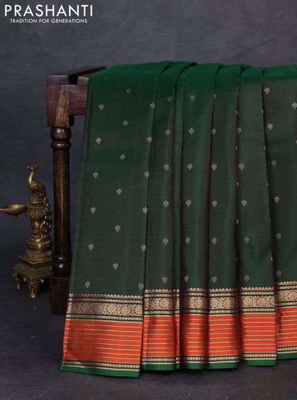 Pure kanchipuram silk saree bottle green and coffee brown with allover zari woven buttas and zari woven border