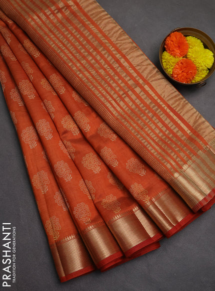 Semi raw silk saree rustic orange with allover butta prints and zari woven border