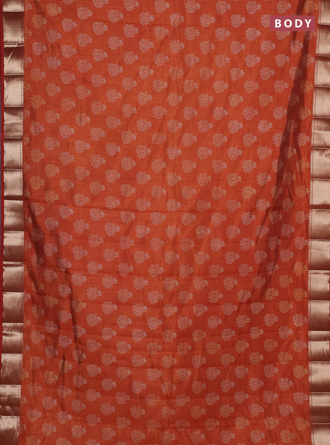 Semi raw silk saree rustic orange with allover butta prints and zari woven border