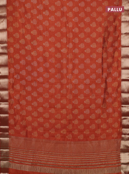 Semi raw silk saree rustic orange with allover butta prints and zari woven border