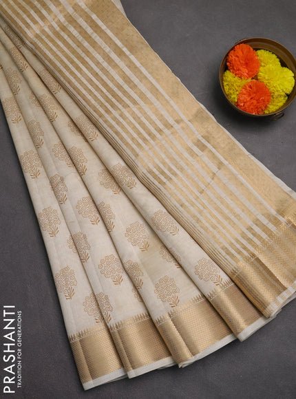 Semi raw silk saree cream with allover butta prints and zari woven border