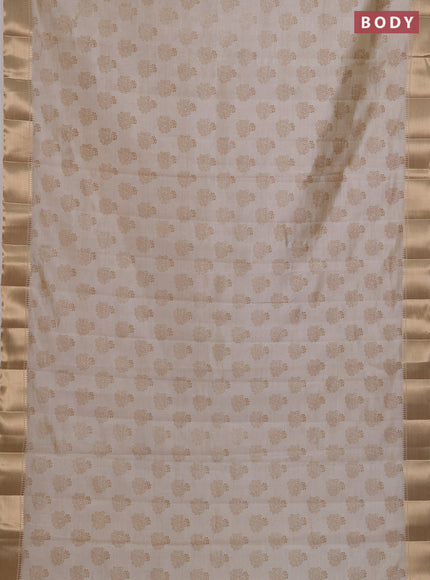 Semi raw silk saree cream with allover butta prints and zari woven border