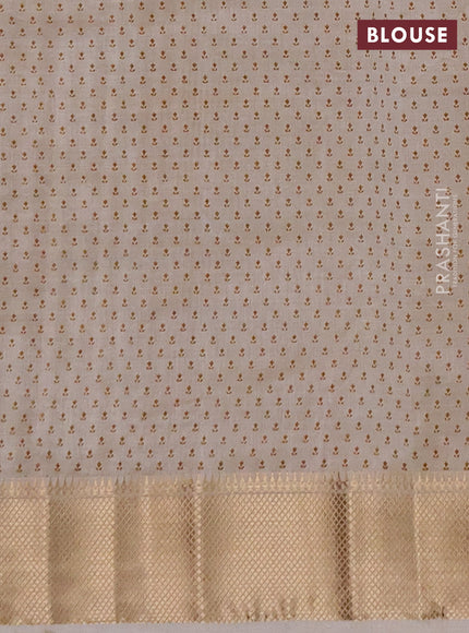 Semi raw silk saree cream with allover butta prints and zari woven border