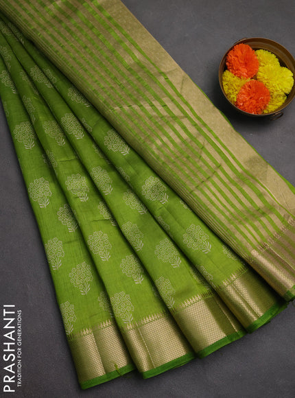 Semi raw silk saree light green with allover butta prints and zari woven border