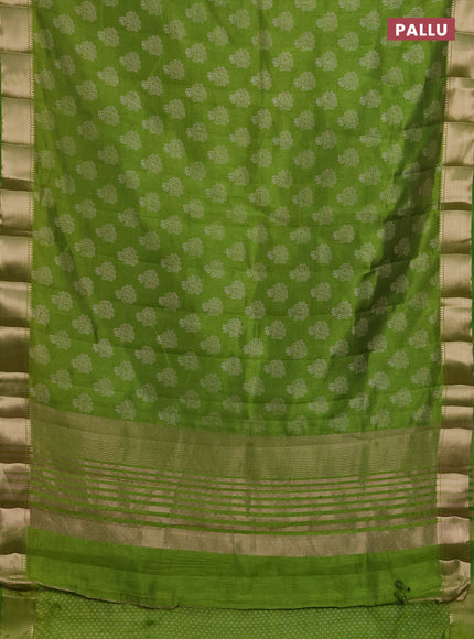 Semi raw silk saree light green with allover butta prints and zari woven border