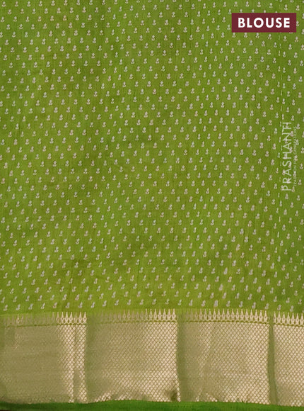 Semi raw silk saree light green with allover butta prints and zari woven border